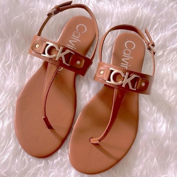 Brand New Calvin Klein Cognac Ankle Strap Thong Sandals Gold Tone Metal Logo - Picture 1 of 12